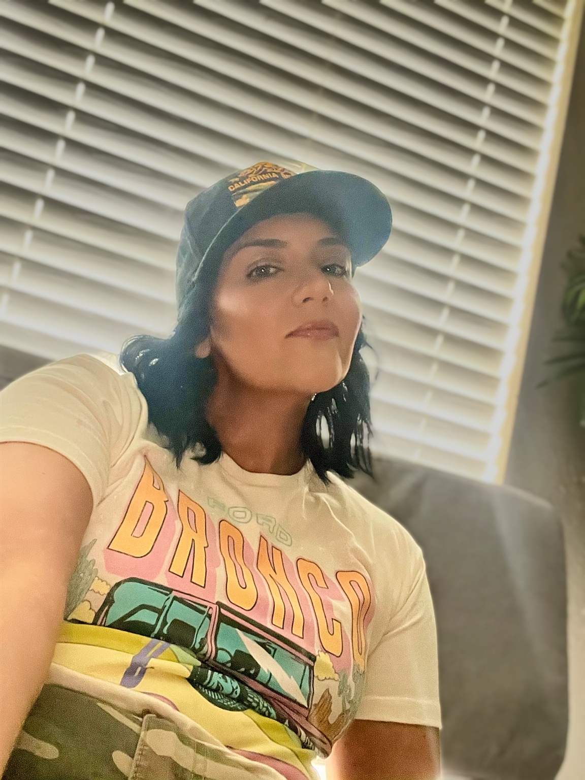 Melonie Howard smiling in a cap